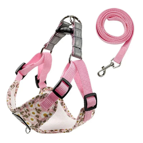 Harnais rose avec motifs fleurs Pâquerettes et sa laisse assortie pour petit chien. Réglable et confortable, convient aux petits chiens, chihuahuas, ou aux chats.